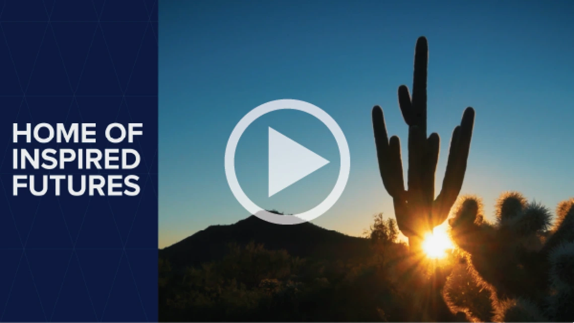 Image of a saguaro and cholla cactus at dusk with the sun shining through them and mountains in the background. To the left it says Home of Inspired Futures.