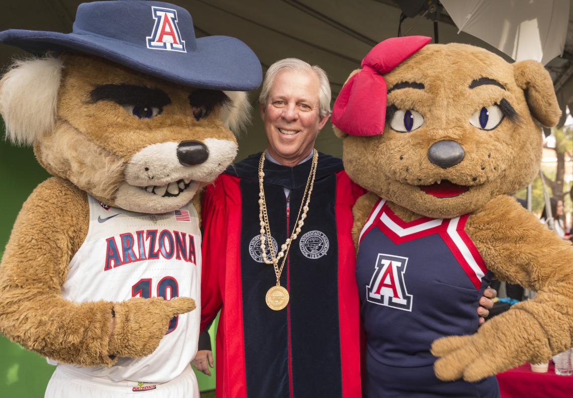 Mascots Wilbur and Wilma welcome Dr. Robbins.