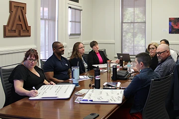 staff members meeting in a room