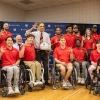 U of A President Suresh Garimella accepts a ceremonial basketball, autographed by members of the national champion men's wheelchair basketball team